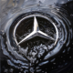 A.I. Black oil running down a Mercedes Logo